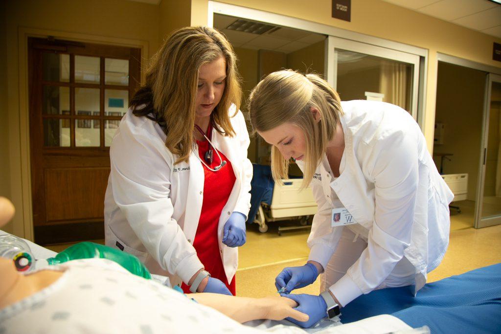 Nursing instructor directs a student